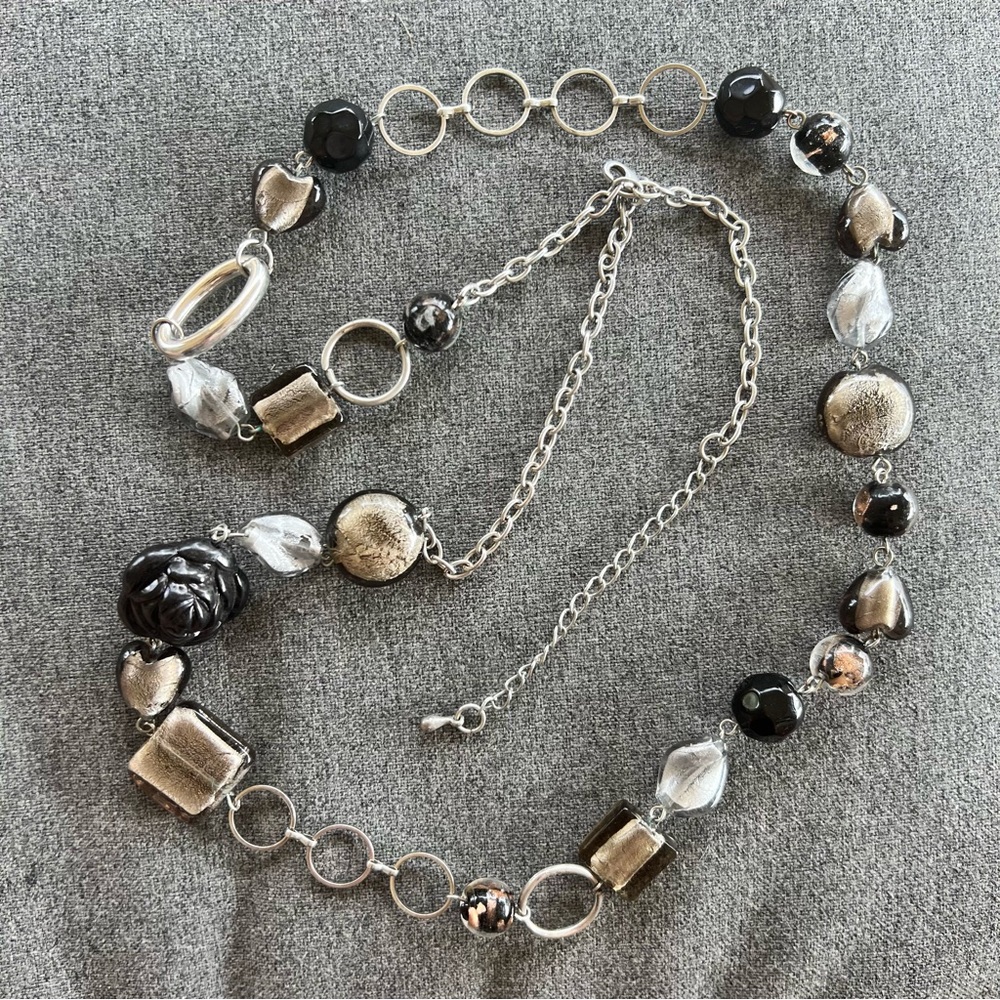 Black and silver beaded statement necklace with various shaped glass metal beads